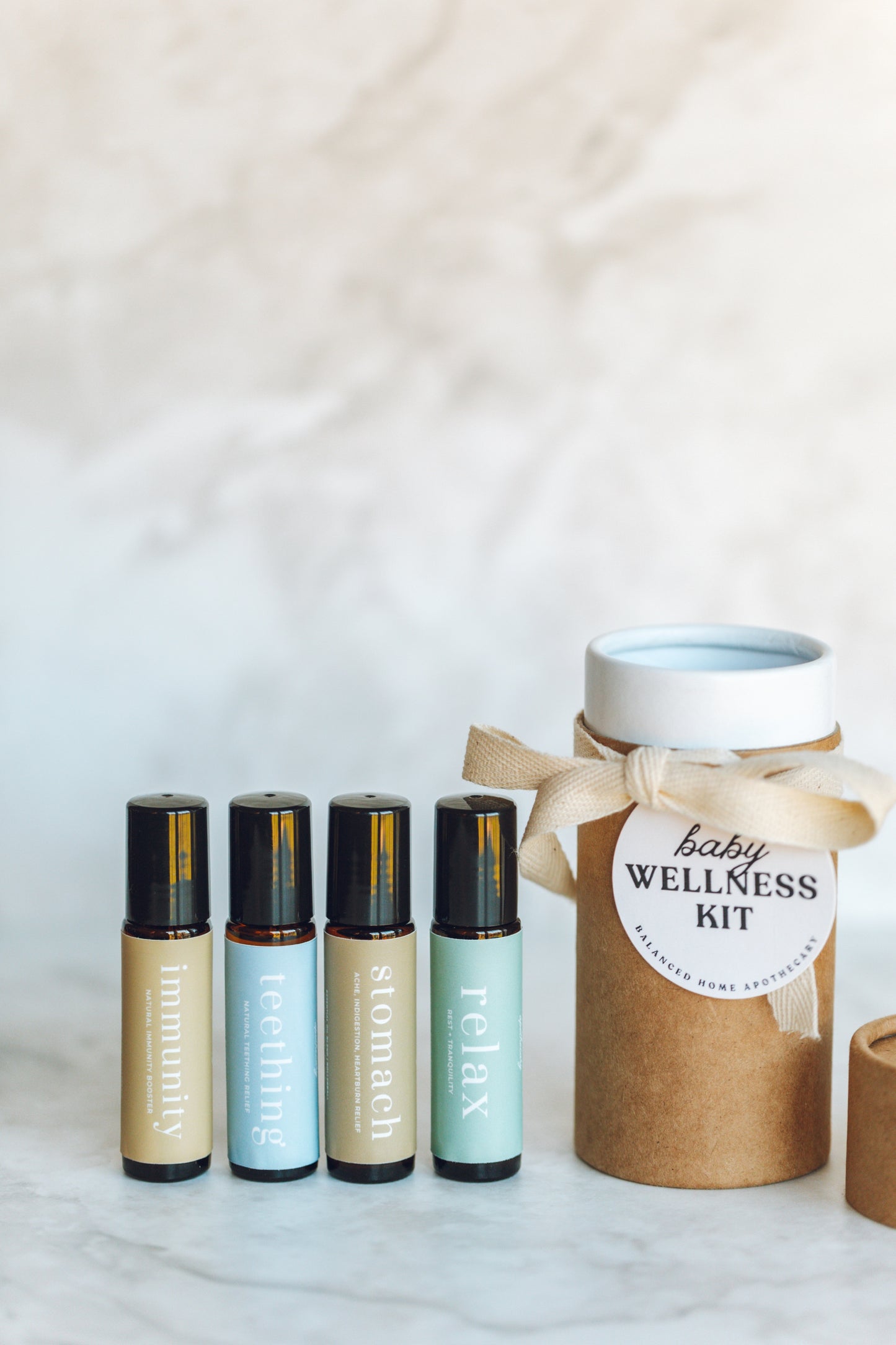 Baby wellness kit with roller bottles and a wrapped jar on a light background
Lavender chamomile copaiba teething rollerball for babies
Gentle teething relief with safe essential oils
Natural baby teething roller with organic fractionated coconut oil
