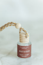 autumn essential oil blend in a hanging car diffuser bottle labeled autumn
