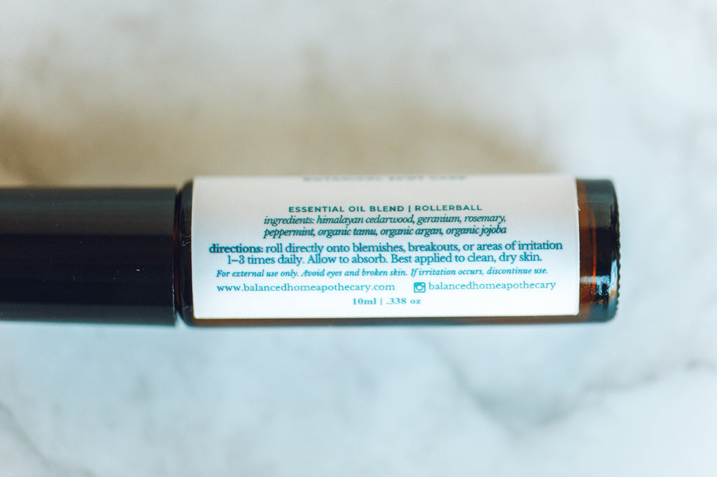 Essential oil blend rollerball with label on a white background