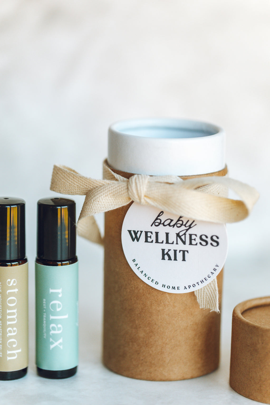 Baby wellness kit with essential oil bottles on a white background