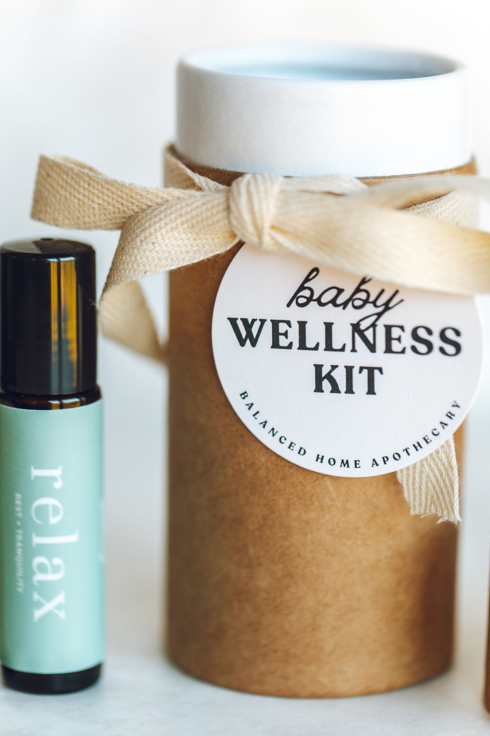 Baby wellness kit with a bottle labeled 'relax' on a white background